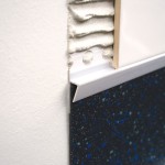 PVC vinyl to tile joint - punched flange PVC vinyl to tile joint - punched flange