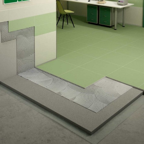 System for installation of porcelain stoneware tiles or clinkers on floors subject to strong chemical aggression